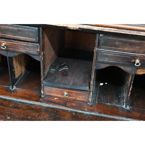 374 - A Georgian mahogany bureau with two short over three long drawers, with associated glazed bookcase t... 