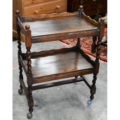 376 - An oak two-tier trolley on barley twist supports, 60 x 40 x 80 cm h