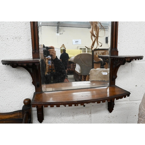 377 - A bevelled wall mirror in fret-cut simulated bamboo frame with three shelves in Chippendale manner, ... 