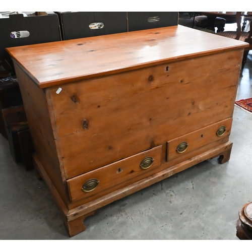 379 - An antique waxed pine mule chest with hinged top and two drawers, raised on bracket feet, 110 x 56 x... 