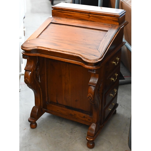 380 - A stained hardwood Davenport with hinged sloping top and four drawers to each side, 55 x 50 x 80 cm ... 