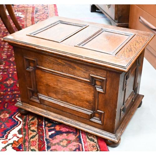 383 - A panelled oak slipper/coal box on bun feet, 50 x 36 x 36 cm h