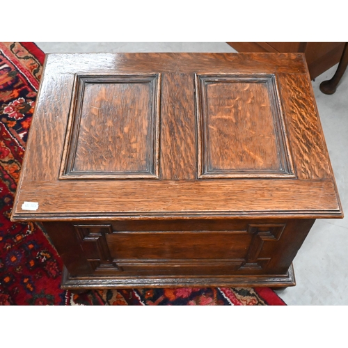 383 - A panelled oak slipper/coal box on bun feet, 50 x 36 x 36 cm h