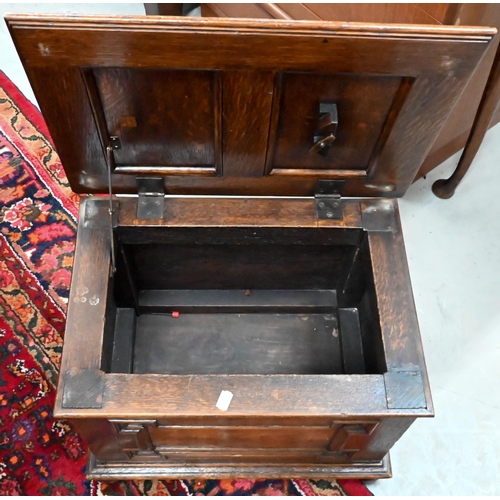 383 - A panelled oak slipper/coal box on bun feet, 50 x 36 x 36 cm h