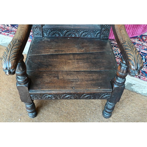 391 - Antique Wainscott style oak low armchair carved with dragons
