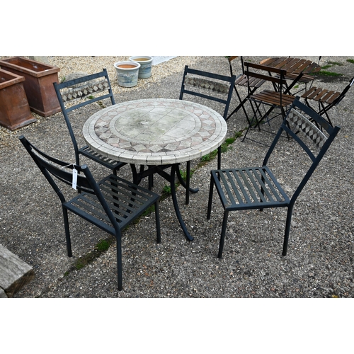 4 - A weathered five piece composite stone and steel framed terrace set comprising a circular table and ... 