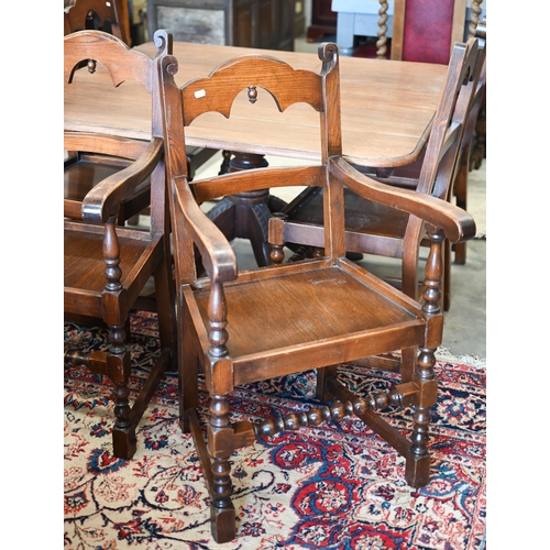 401 - Set of six oak reproduction Yorkshire dining chairs with panelled seats and turned supports, two car... 