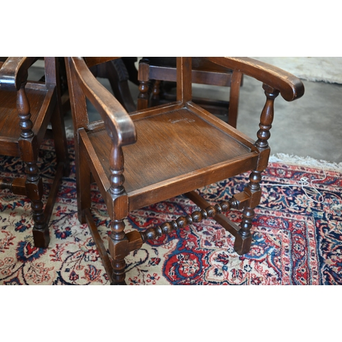 401 - Set of six oak reproduction Yorkshire dining chairs with panelled seats and turned supports, two car... 