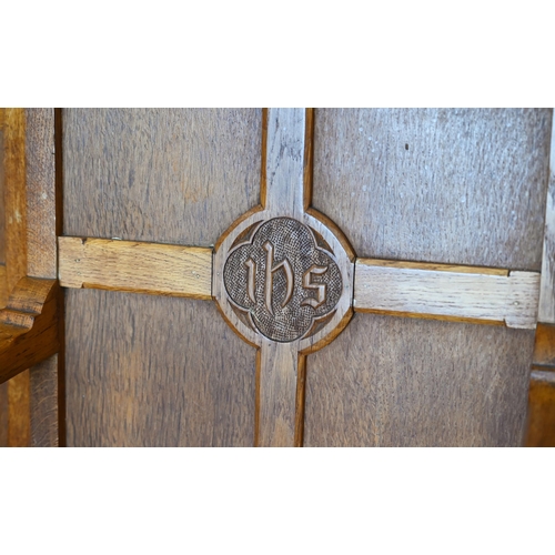 410 - A panelled oak church armchair to/w pair of matching side chairs, with inscription 'IHS' (3)