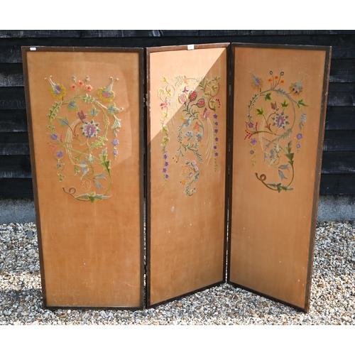 415 - A three-panel folding screen with floral crewel embroidery, 156 cm wide x 135 cm high overall