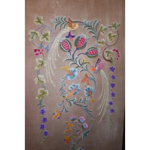 415 - A three-panel folding screen with floral crewel embroidery, 156 cm wide x 135 cm high overall