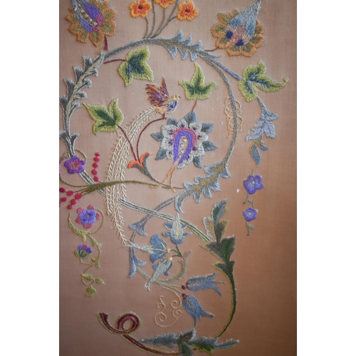 415 - A three-panel folding screen with floral crewel embroidery, 156 cm wide x 135 cm high overall