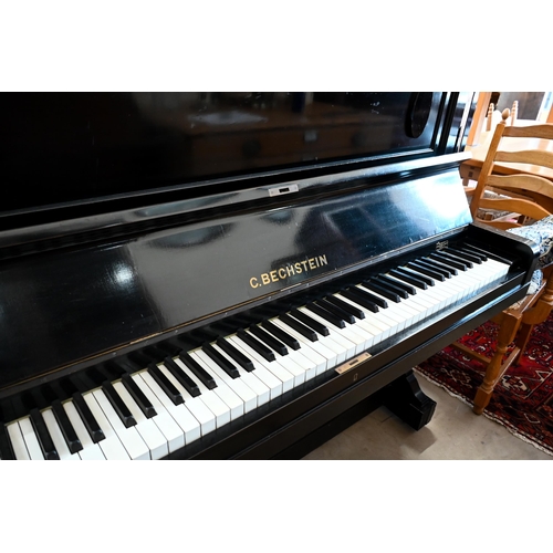 437 - C. Bechstein ebonised upright piano with ivory keys, frame number 81110, case numbered 13135 with Di... 