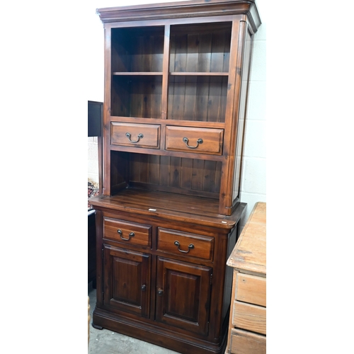 438 - A modern hardwood (Oak Furniture Land, Cranbrook) dresser with four drawers and panelled cupboards, ... 