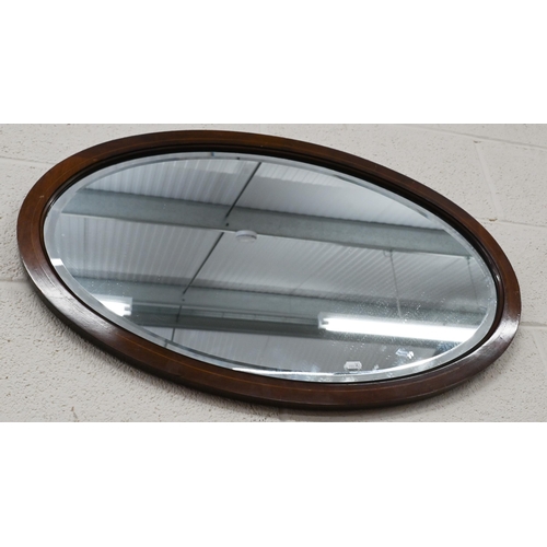 439 - A rectangular wall mirror in gilded and ebonised frame 35 x 42 cm, to/w two oval wall mirrors (3)