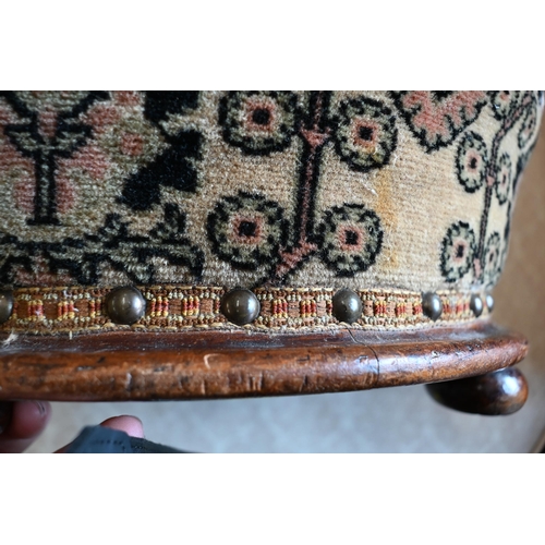 440 - A mahogany framed circular footstool with studded foliate upholstery, 36 cm dia.