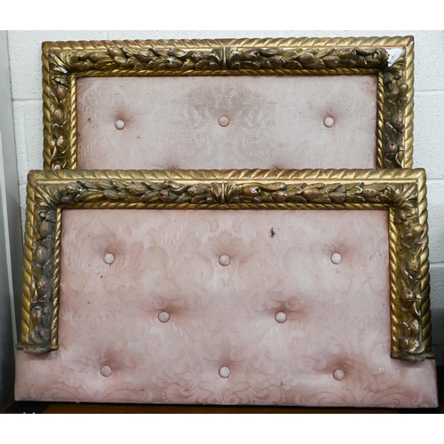 447 - A giltwood and gesso foliate moulded children's bed head and foot boards with buttoned pink damas up... 