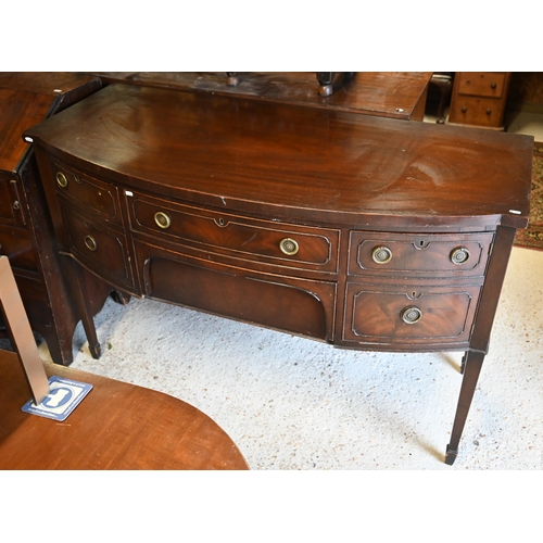 469 - # An old mahogany bowfront sideboard on slender turned legs to brass castors, 137 cm x 63 cm x 90 cm... 