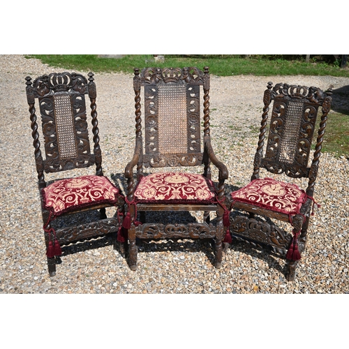 475 - # An antique carved walnut cane panelled carver to/w a pair of similar side chairs in the Carolean s... 