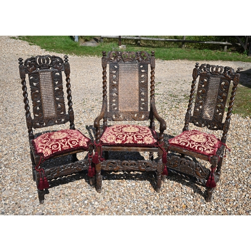 475 - # An antique carved walnut cane panelled carver to/w a pair of similar side chairs in the Carolean s... 