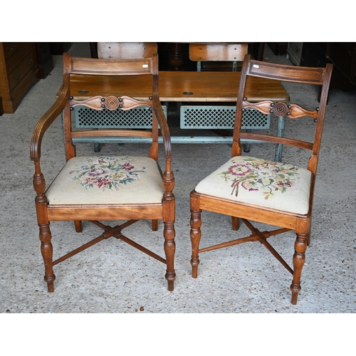 477 - A set of four Regency mahogany side chairs with needlepoint upholstered pads, floral design to/w a m... 