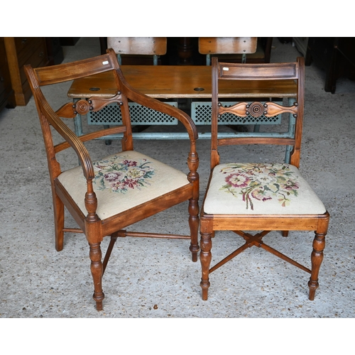 477 - A set of four Regency mahogany side chairs with needlepoint upholstered pads, floral design to/w a m... 