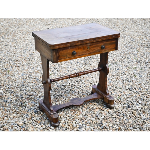 497 - A Victorian mahogany fold over chequerboard top games table, with frieze drawer raised on shaped tre... 