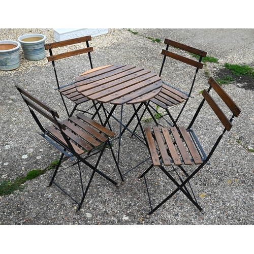 5 - A weathered five piece wood slat and steel folding framed terrace set, the circular table 60 cm dia.... 