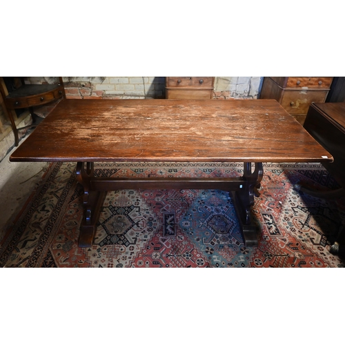 505 - # An oak refectory table raised on shaped trestle ends united by a centre stretcher, 152 x 76 x 75 c... 