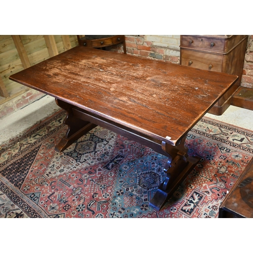 505 - # An oak refectory table raised on shaped trestle ends united by a centre stretcher, 152 x 76 x 75 c... 