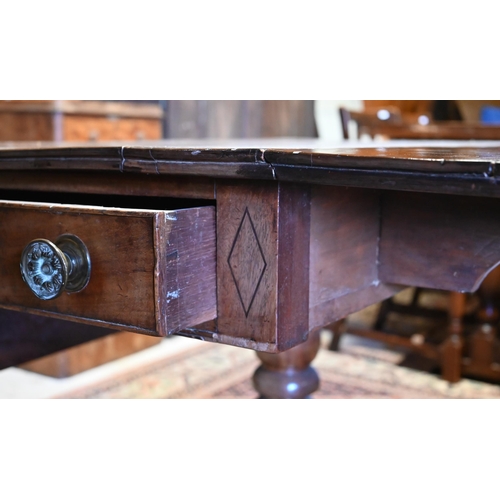 508 - # A Victorian cross-banded mahogany drop leaf table with frieze drawer to one end, raised on a swept... 