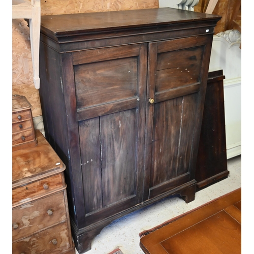 519 - An antique mahogany twin panelled door cupboard/wardrobe, raised on shaped bracket feet, 113 cm x 56... 