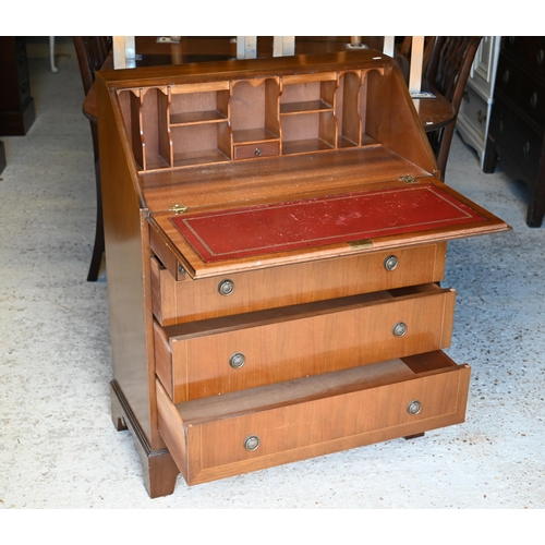 522 - # A 1970's mahogany bureau with four drawers, raised on shaped bracket feet, 76 cm x 38 cm x 100 cm ... 