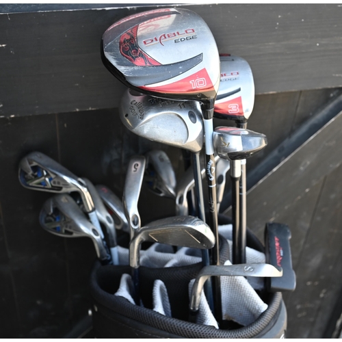 538 - A Taylormade golf bag with mixed part sets of Callaway golf clubs