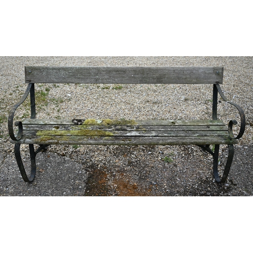 7 - A weathered wood slat and wrought iron framed garden bench, 166 cm w - a/f
