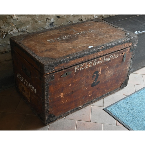 74 - An old steel bound wooden military style trunk stencilled '1st KGL Gurkha Rifles' and 'B M Berthon',... 