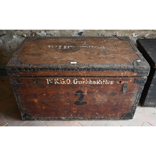 74 - An old steel bound wooden military style trunk stencilled '1st KGL Gurkha Rifles' and 'B M Berthon',... 