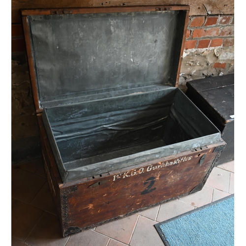 74 - An old steel bound wooden military style trunk stencilled '1st KGL Gurkha Rifles' and 'B M Berthon',... 