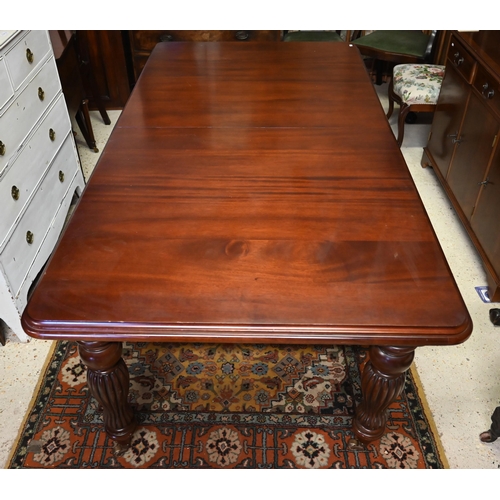 92 - A Regency style mahogany extending dining table with single wide leaf raised on bobbin reeded turned... 