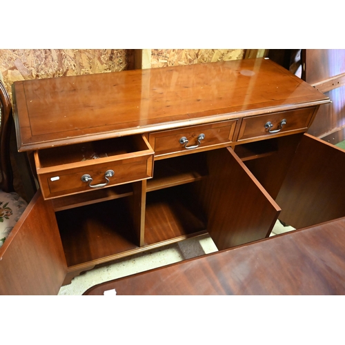 96 - # A reproduction yew three drawer over three cupboard sideboard, 122 cm x 45 cm x 81 cm h