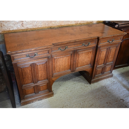 Howard & Sons, Berners St, London, a late 19th century golden oak inverted breakfront sideboard (lacking mirror panelled back), 183 cm x 62 cm x 93 cm h
