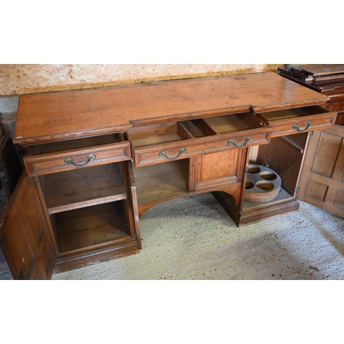 97 - Howard & Sons, Berners St, London, a late 19th century golden oak inverted breakfront sideboard ... 