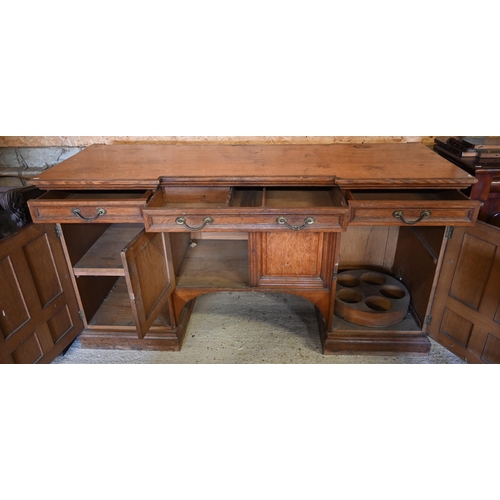 97 - Howard & Sons, Berners St, London, a late 19th century golden oak inverted breakfront sideboard ... 