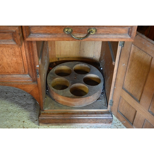 97 - Howard & Sons, Berners St, London, a late 19th century golden oak inverted breakfront sideboard ... 