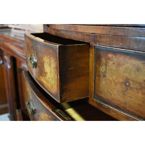 99 - A Victorian mahogany bowfront two part linen press on chest of two short over three long graduated d... 