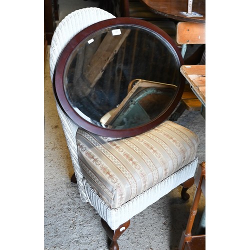 484 - # A vintage Lloyd Loom style nursing chair to/w an oval mirror (2)