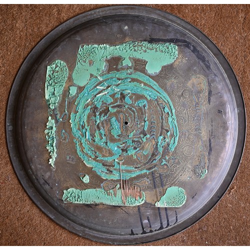 237 - Four large Eastern copper circular trays with engraved decoration