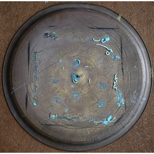 237 - Four large Eastern copper circular trays with engraved decoration