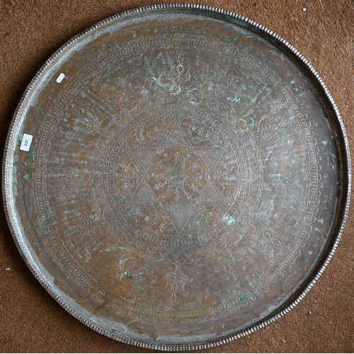 237 - Four large Eastern copper circular trays with engraved decoration