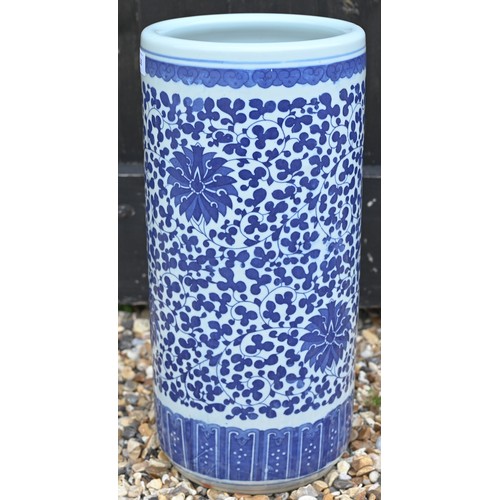 138 - A Chinese blue and white ceramic cylindrical stick-stand with floral and foliate decoration, 46 cm h... 